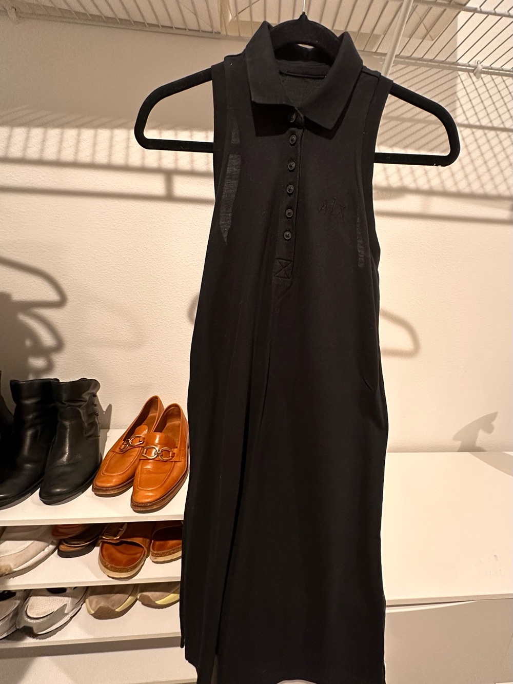 New without tags A|X Armani Exchange black sleeveless polo dress.
Never worn.